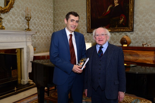 President Michael D Higgins is presented with a copy of the book 'Unthinkable; Great Ideas for Now' by Joe Humphreys at Aras an Uachtarain.